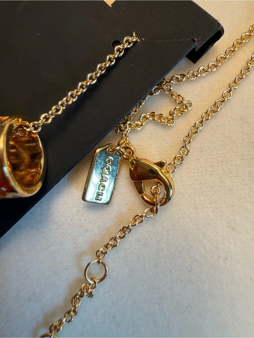 Coach gold tone
